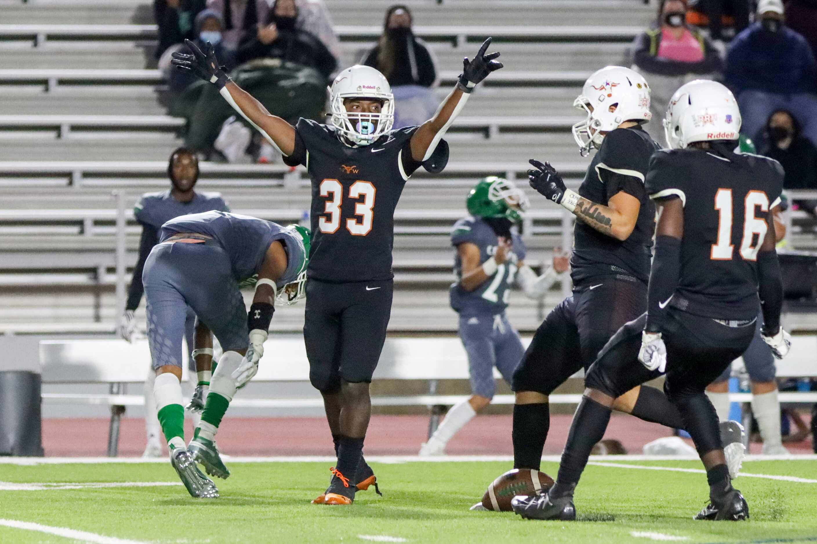 W.T. White defensive back Perry Baker (33) celebrates an incomplete pass during the second...