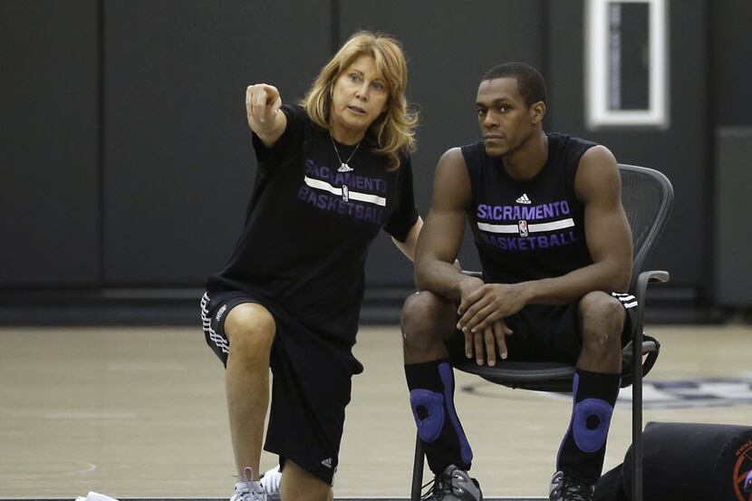 Sacramento Kings assistant coach Nancy Lieberman talks with guard Rajon Rondo during a...