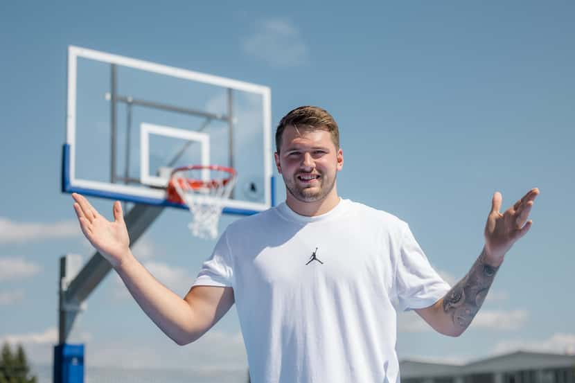 Luka Doncic poses for a picture on the brand new courts he designed for his home town of...