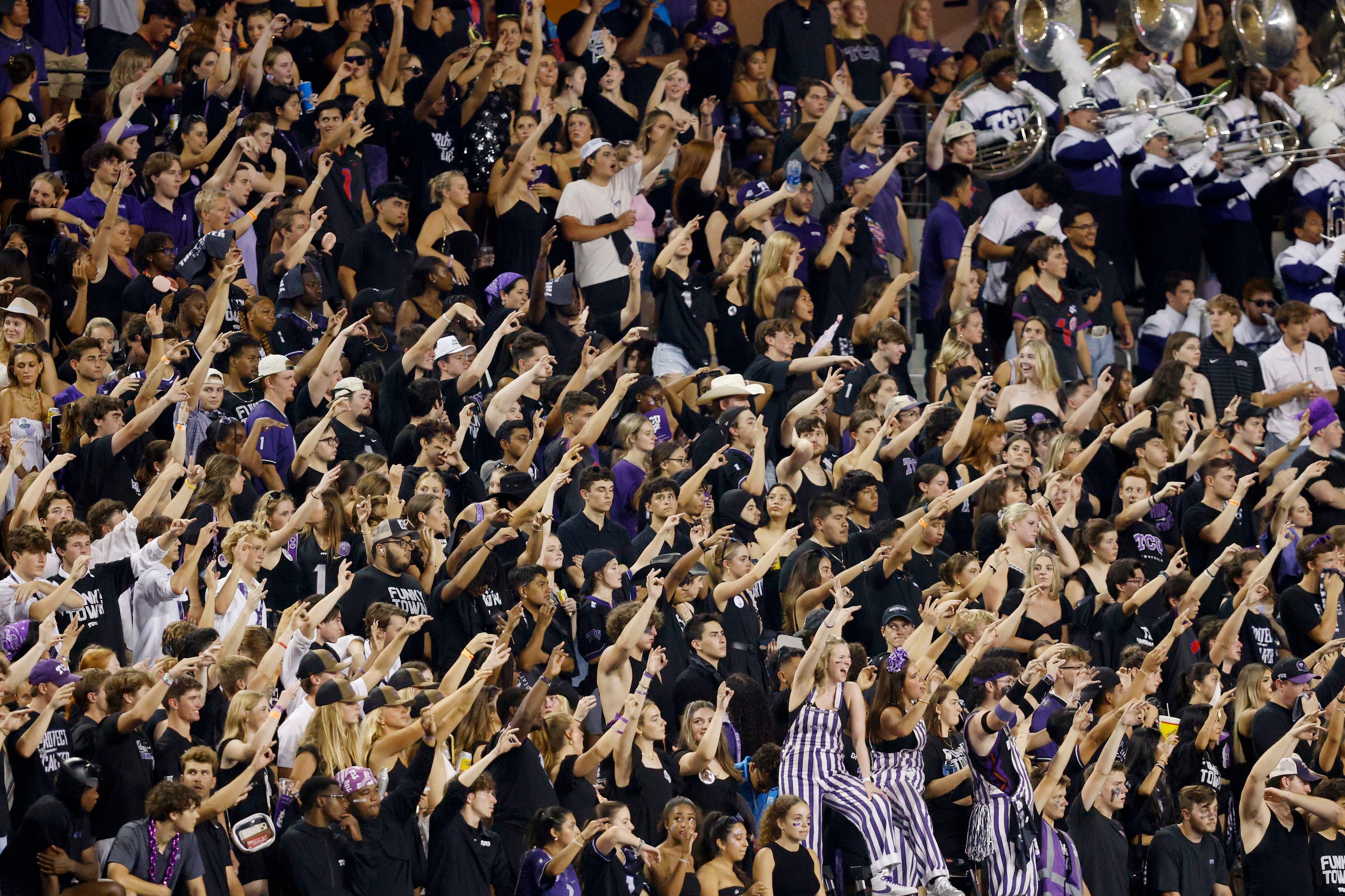 TCU fans cheer during the first half of an NCAA college football game against the UCF at...