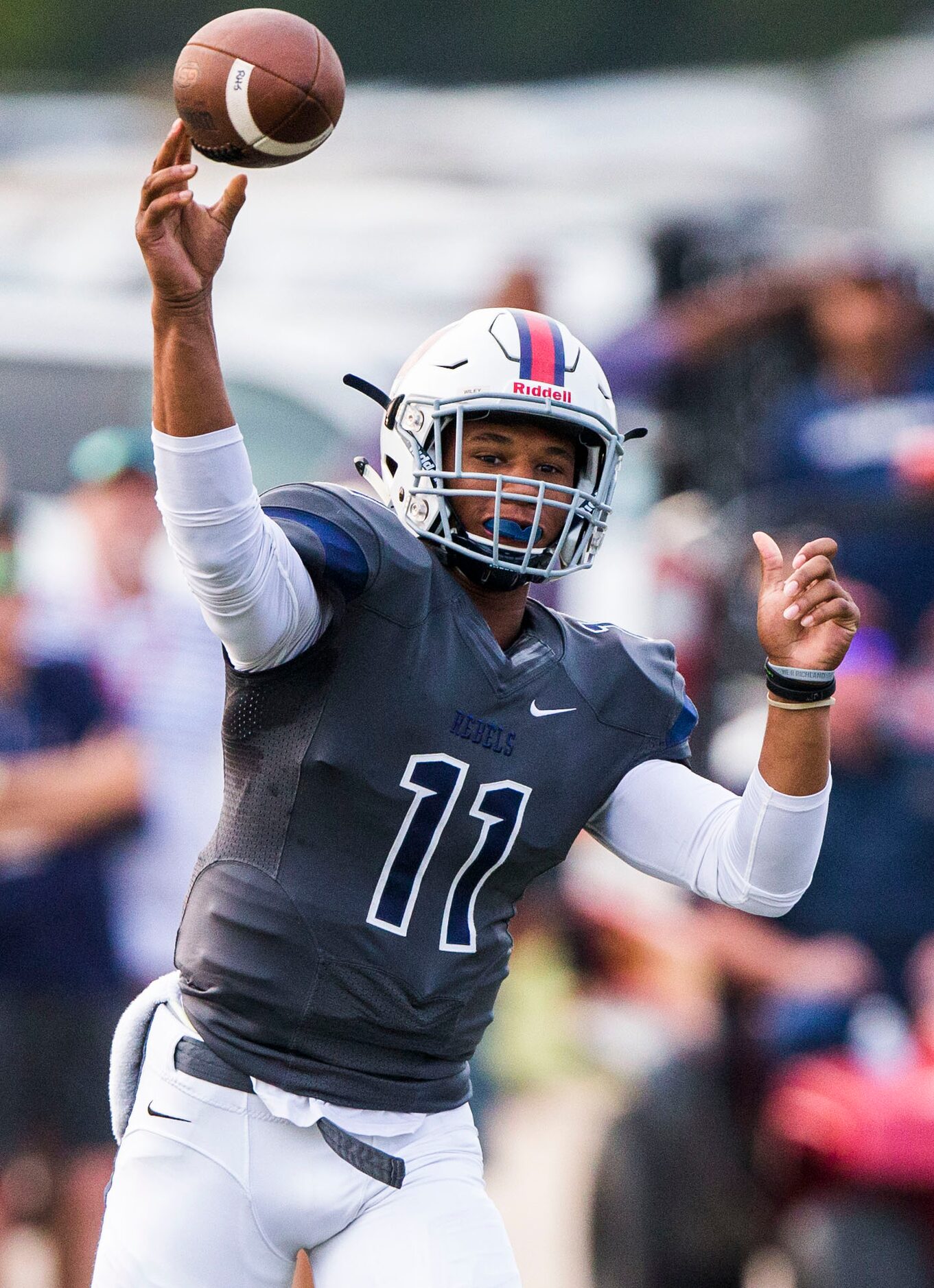 Richland quarterback Jordan Wiley throws a pass during the first quarter of their game on...