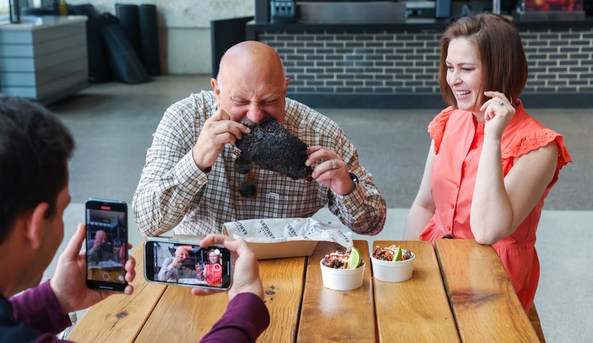 That's me giggling as Evan Grant bites into a Hurtado Barbecue beef rib on Texas Rangers...