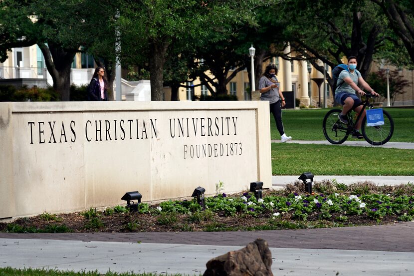 Students cross the campus at TCU in Fort Worth, Texas on Monday April 26, 2021. 