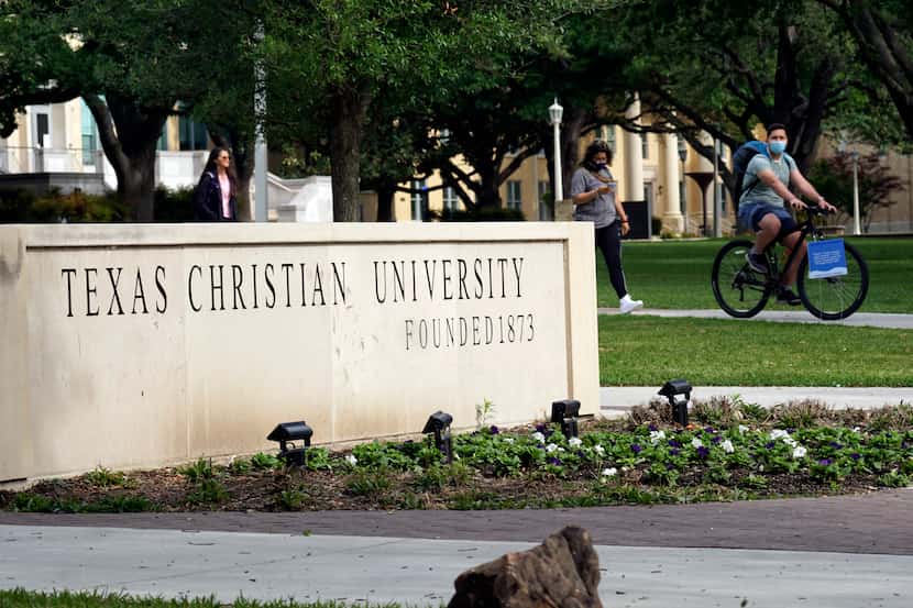 Students cross the campus at TCU in Fort Worth, Texas on Monday April 26, 2021. 