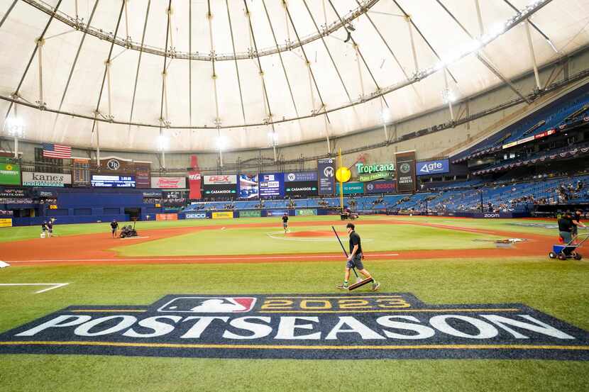 Groundskeepers prepare the field before an American League Wild Card playoff baseball game...