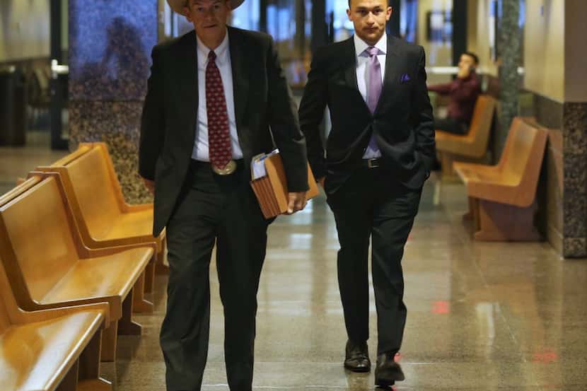 Johnny Manziel (right) walks in to the Frank Crowley Courts Building with his attorney Jim...