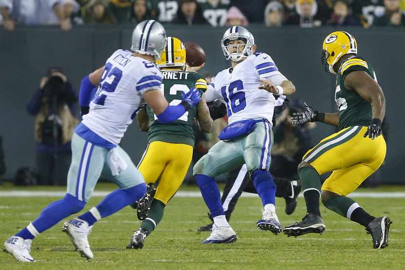 After rolling out under pressure, Dallas Cowboys quarterback Matt Cassel (16) throws a pass...