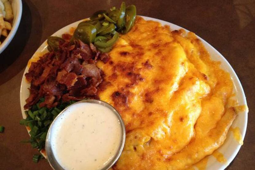 Cheese fries rules: Pile bacon and jalapeños on top, dip in ranch.