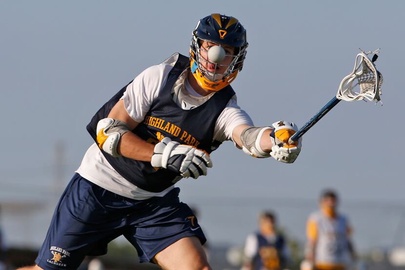 Highland Park lacrosse players work on drills during practice at MoneyGram Park in Dallas on...