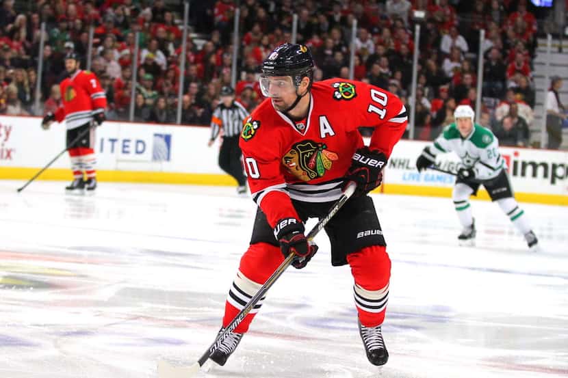 Jan 4, 2015; Chicago, IL, USA; Chicago Blackhawks left wing Patrick Sharp (10) with the puck...