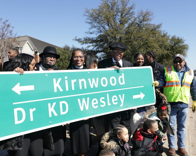 Community members celebrate the renaming of E. Kirnwood Dr. to Dr. KD Wesley Way during a...