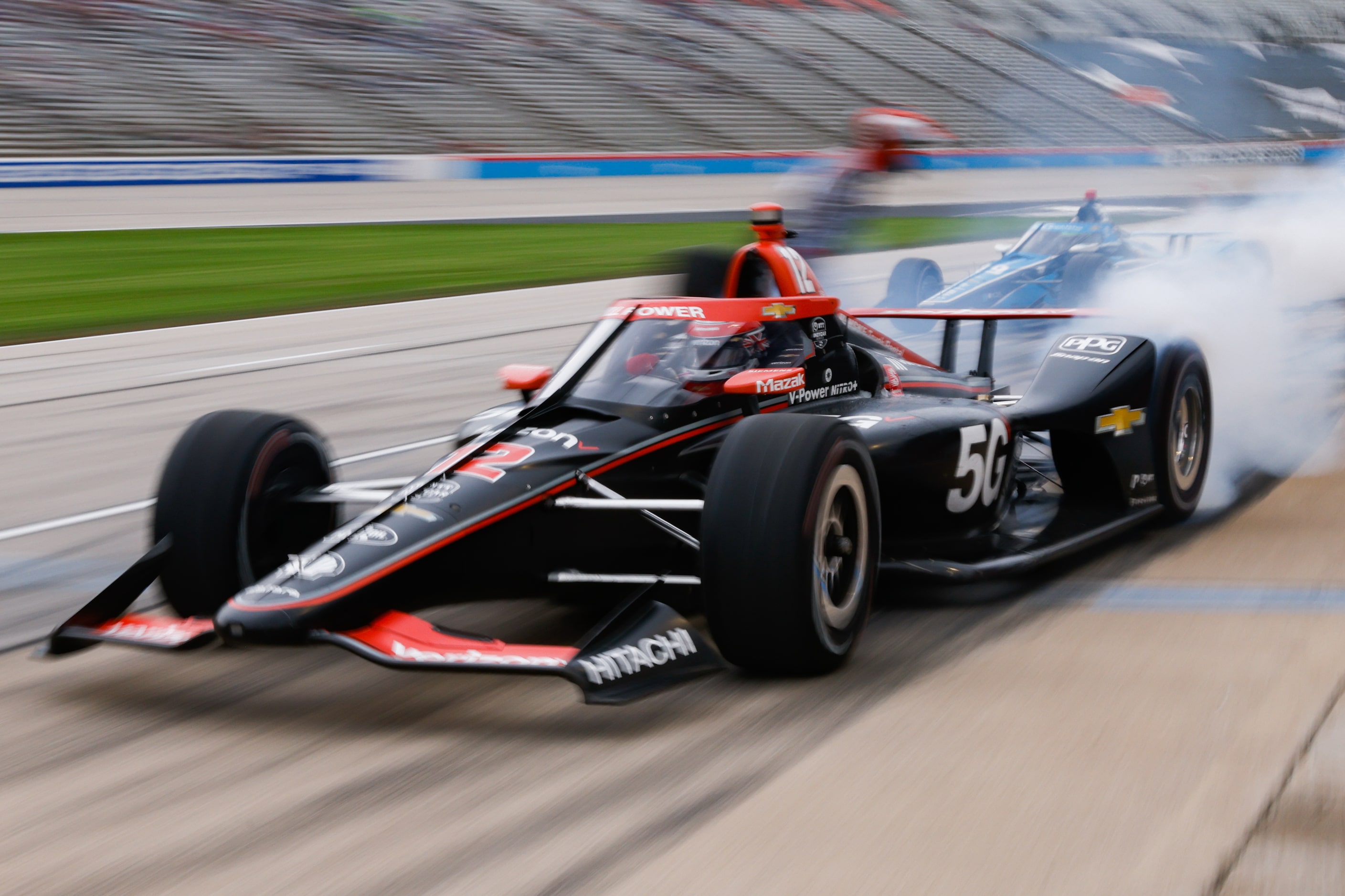 Will Power (#12) takes off following a pit stop during the the IndyCar Genesys 300 race at...