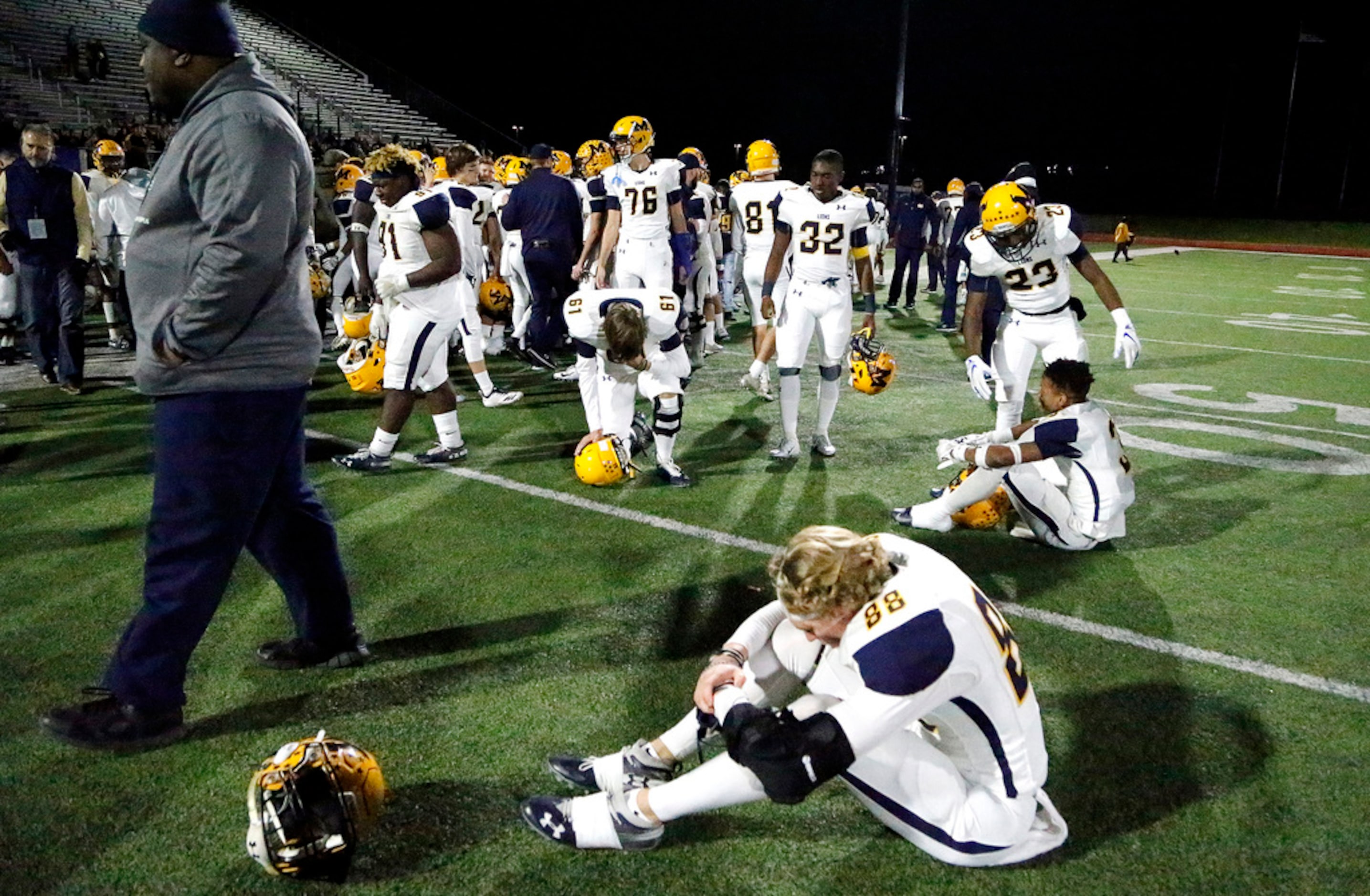 McKinney High School's Bryce Johnson (88) was among team mates in disbelief their season was...