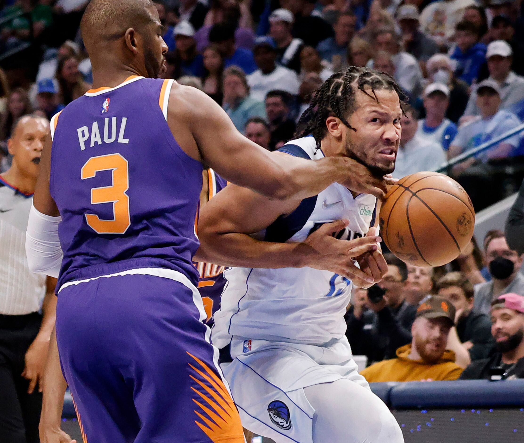 Dallas Mavericks guard Jalen Brunson (13) is hammered by Phoenix Suns guard Chris Paul (3)...