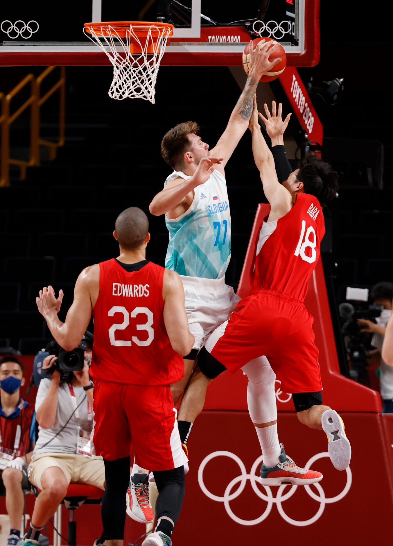 Slovenia’s Luka Doncic (77) blocks a shot from Japan’s Yudai Baba (18) in a basketball game...