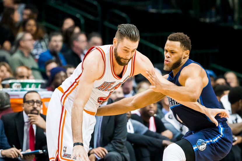 FILE - Miami Heat forward Josh McRoberts (4) drives against Dallas Mavericks guard Justin...