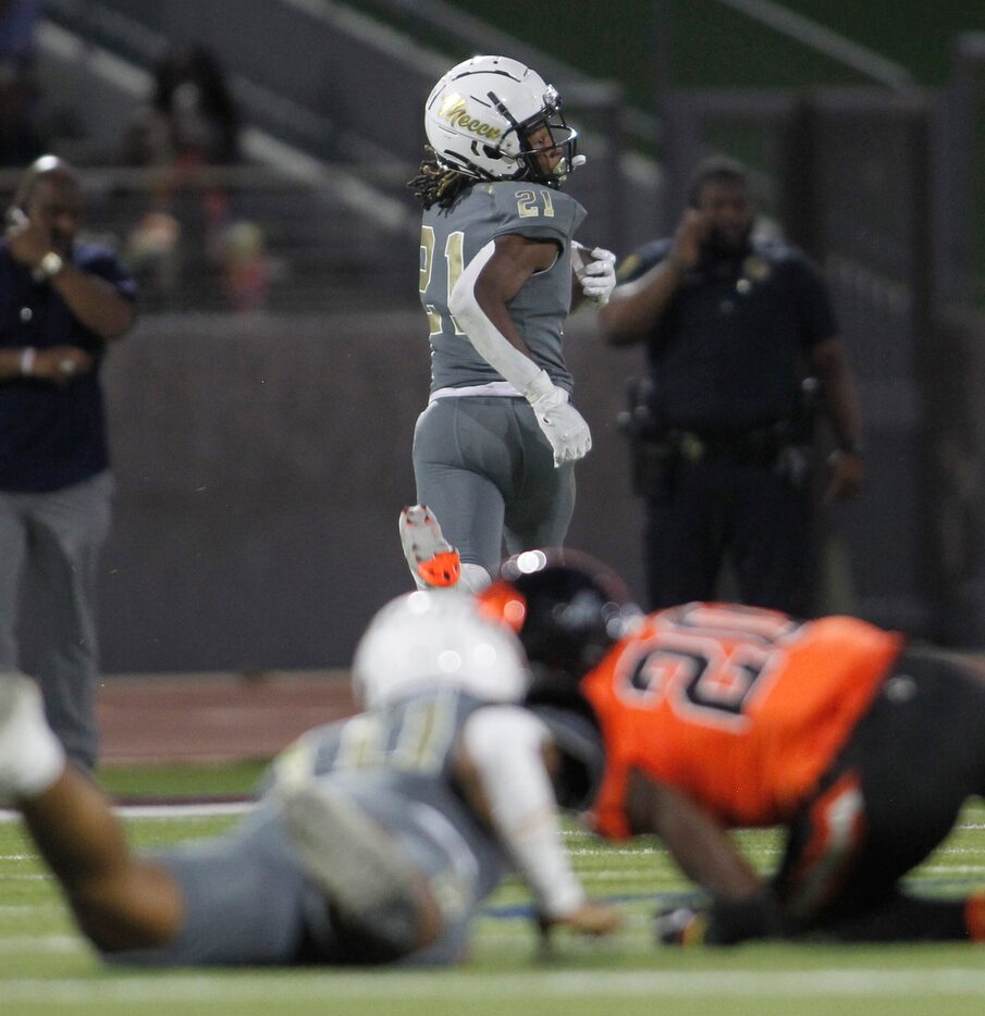 South oak Cliff running back Danny Green (21) looks over his shoulder enroute to a rushing...