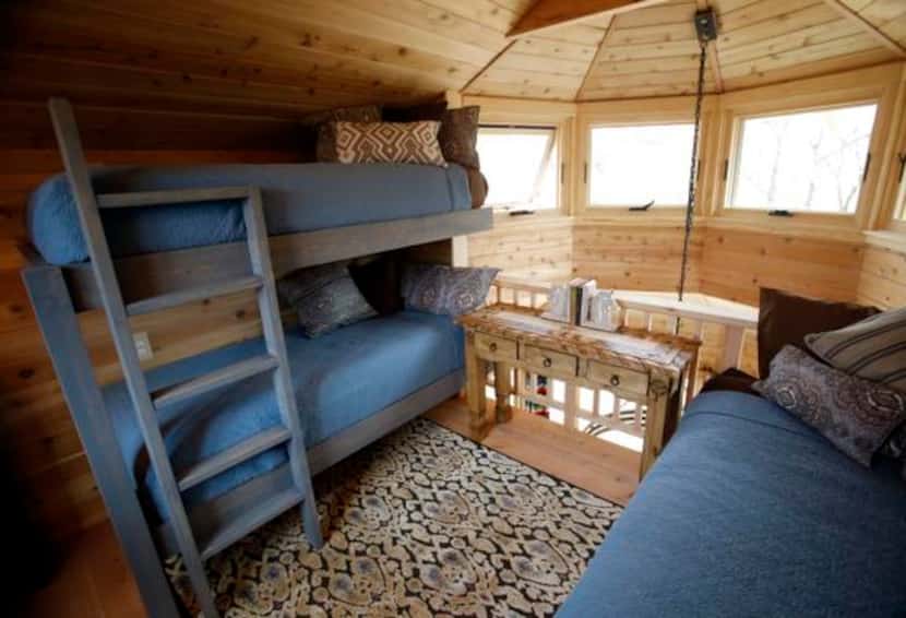
Not every treehouse has sleeping quarters, but this one has a loft that holds a queen-size...