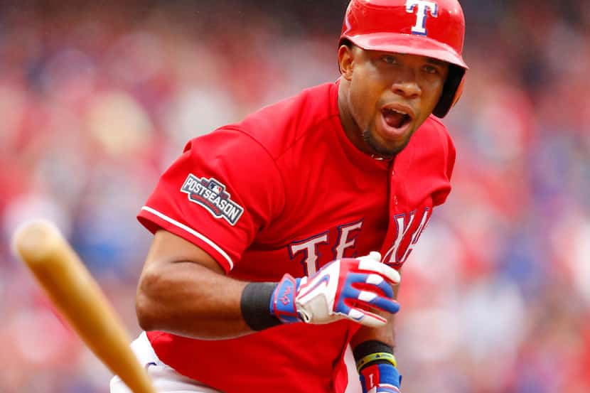 Texas Rangers batter Elvis Andrus (1) tosses his bat after hitting a double during the...