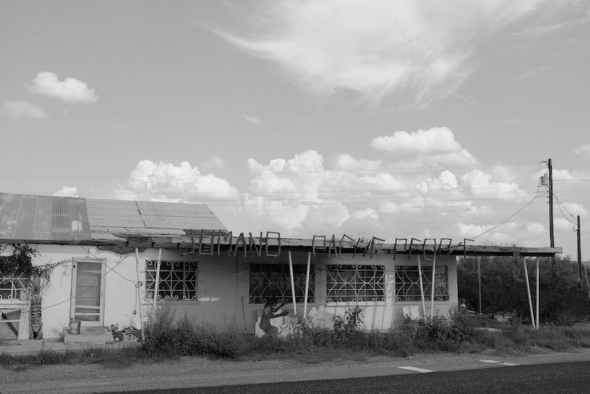 A building in Redford, Texas, has "Jumano Apache People" spelled in cedar branches. The...