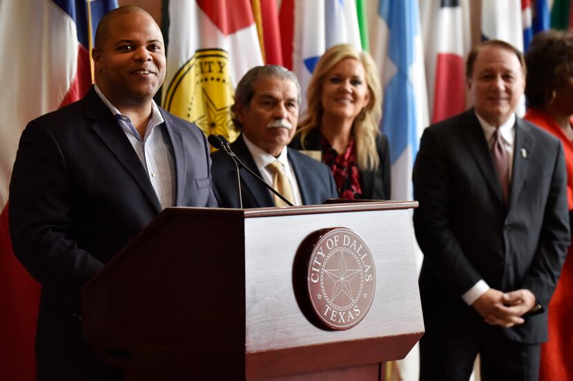 Dallas Mayor Eric Johnson (left) announces a new youth workforce initiative Monday at City...