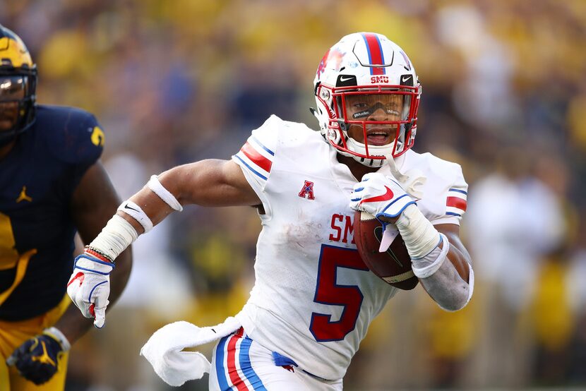 ANN ARBOR, MI - SEPTEMBER 15: Xavier Jones #5 of the Southern Methodist Mustangs outruns the...