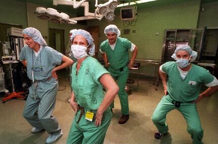 Operating room personnel get down to the 'Macarena' in 1996. Everybody was doing it.