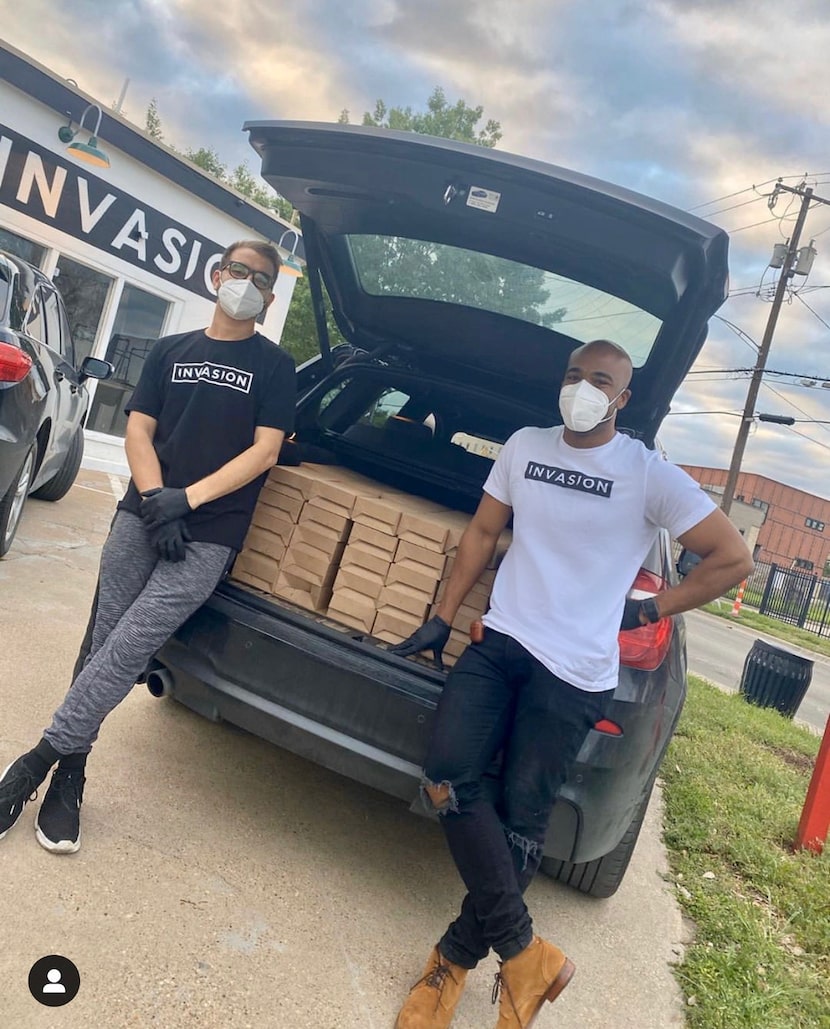 Agon Raka (left) and chef Airric Heidelberg of Invasion restaurant feed the homeless before...