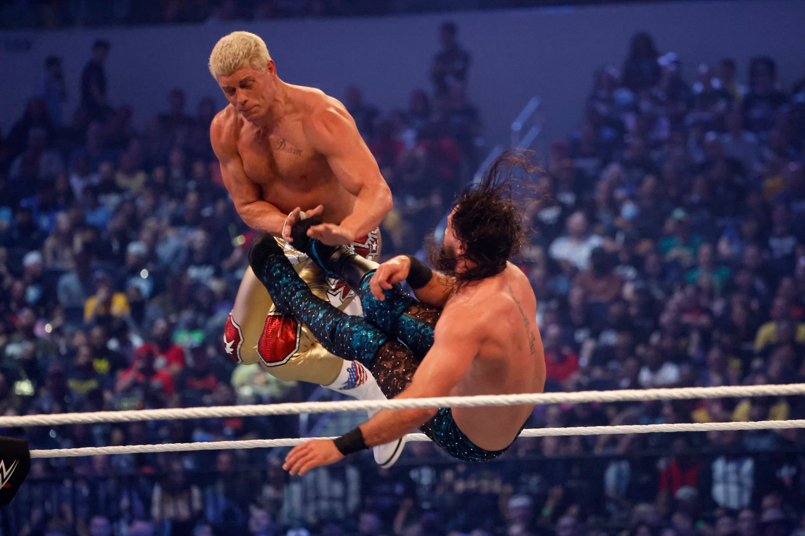 Cody Rhodes, left, and Seth Rollins wrestle during WrestleMania in Arlington, Texas on...