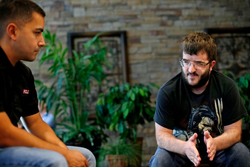 
Justin Arsenault (left), an Allen patrol officer, gets to know Preston, from My...