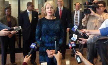  Dallas County District Attorney Susan Hawk speaks to reporters Thursday outside her office....