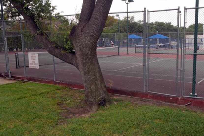 The tennis courts at Curtis Park in University Park would be torn down if a natatorium is...