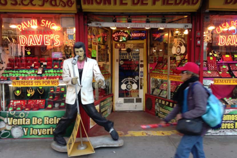 A life-size statue of Elvis Presley greets customers in front of Dave's Pawn Shop in El Paso.