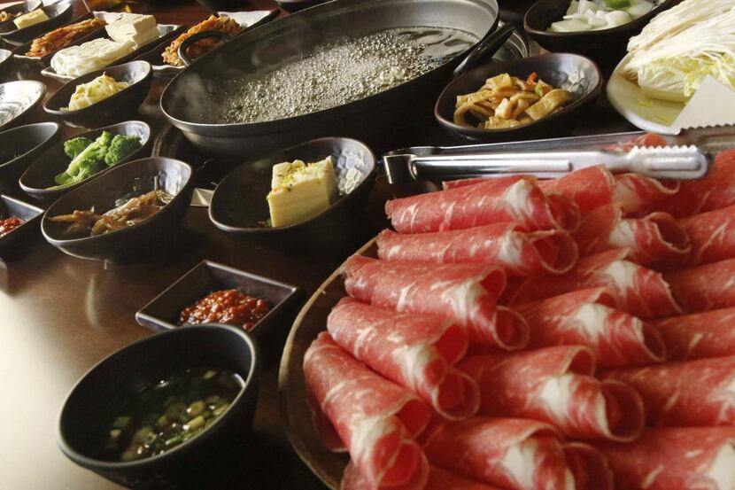 
The table is set for a Korean favorite: “Shabu shabu is what I call festive food,” says...