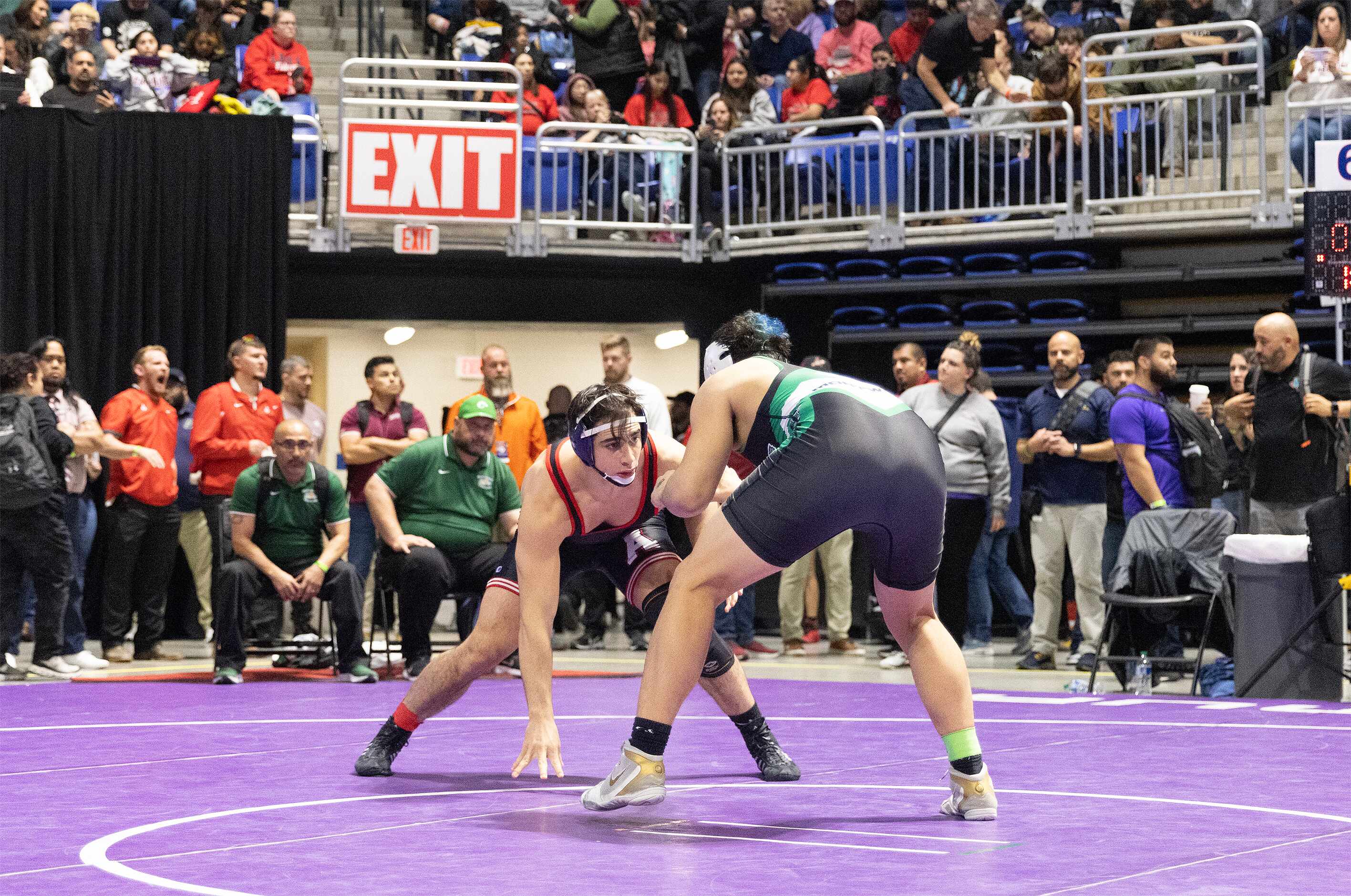 Ryan Nichols from Allen (left) wrestles Jose Angel Rosales in the 6A boys 215 pound division...