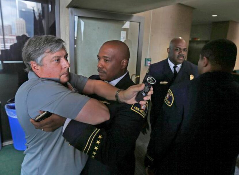 
L.P. Phillips, a reporter for KRLD-AM (1080), was restrained from following Fire Chief...