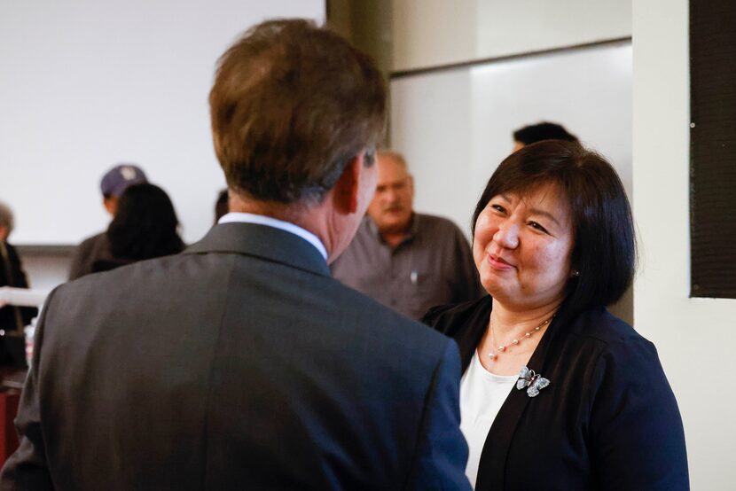 Sinmin Pak, founder of Unforgotten Butterflies, talks to attendees after a panel discussion...