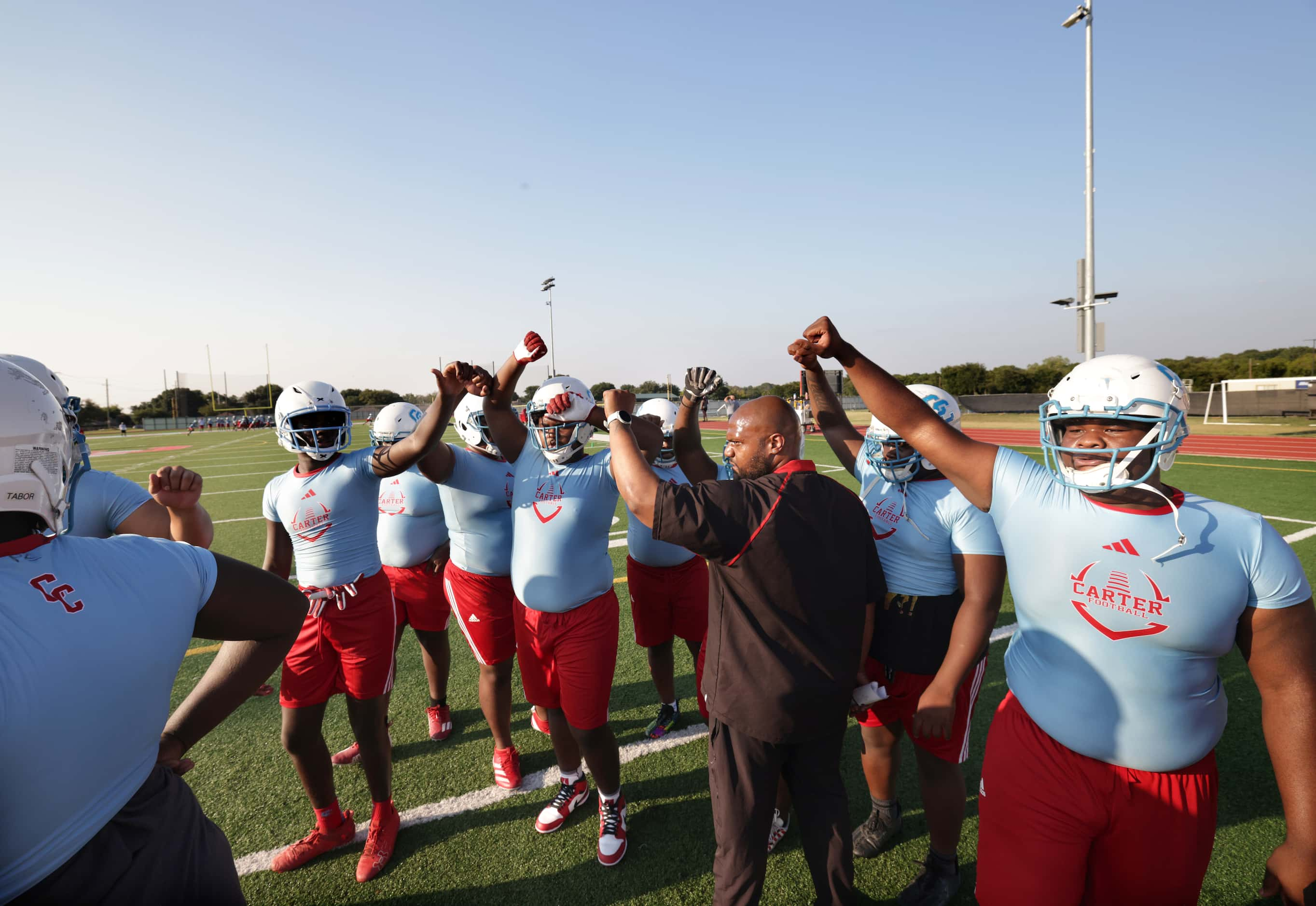 Players attend their first day of football practice at Carter High School in Dallas, TX, on...