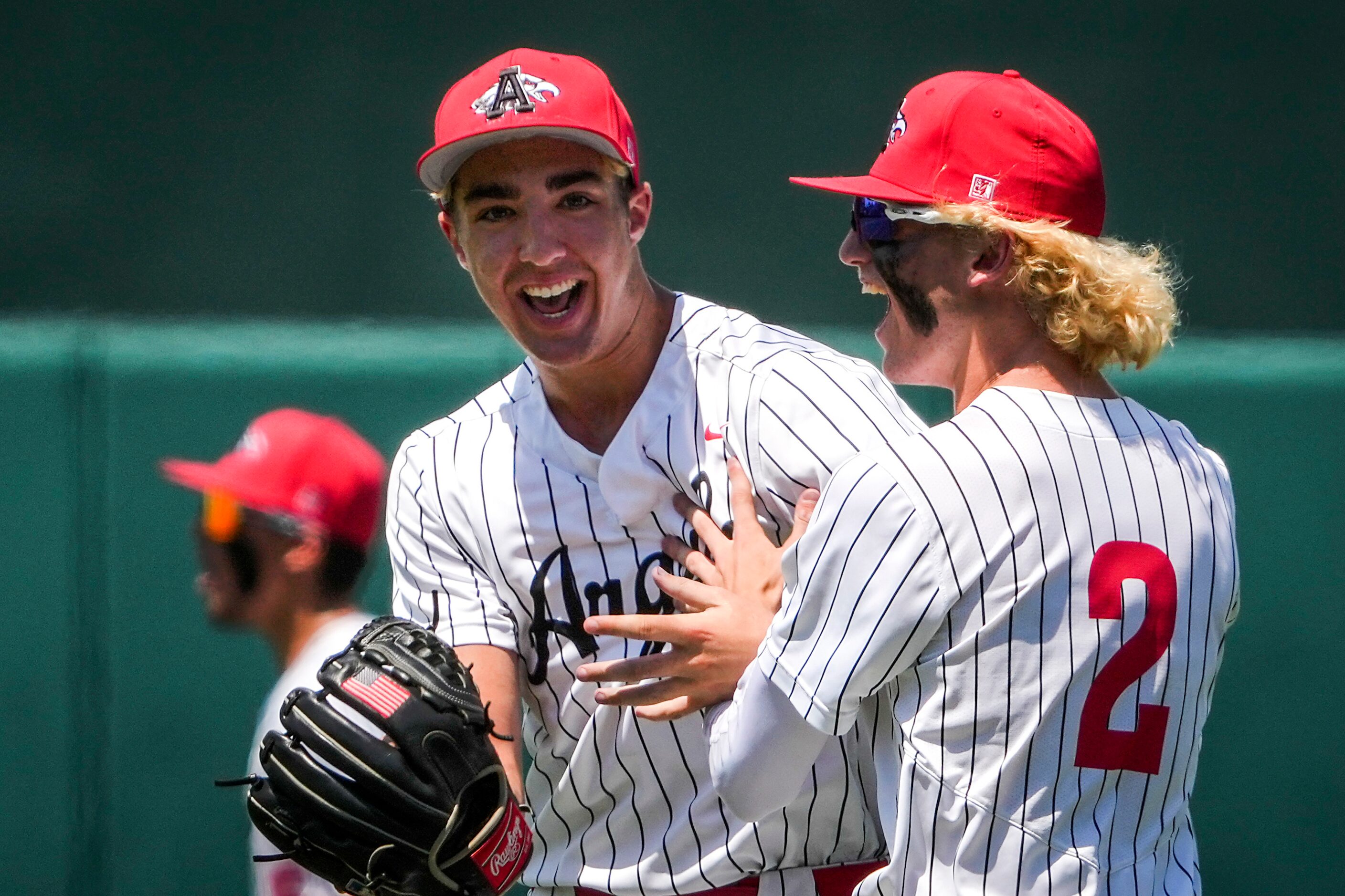 Argyle pitcher Evan Brandt (left) celebrates with first baseman Alex D'Angelo after the...