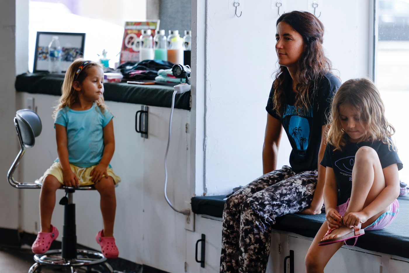 Amanda Alvarez, (center), a salsa teacher and boxing lover, observes a boxing workout with...