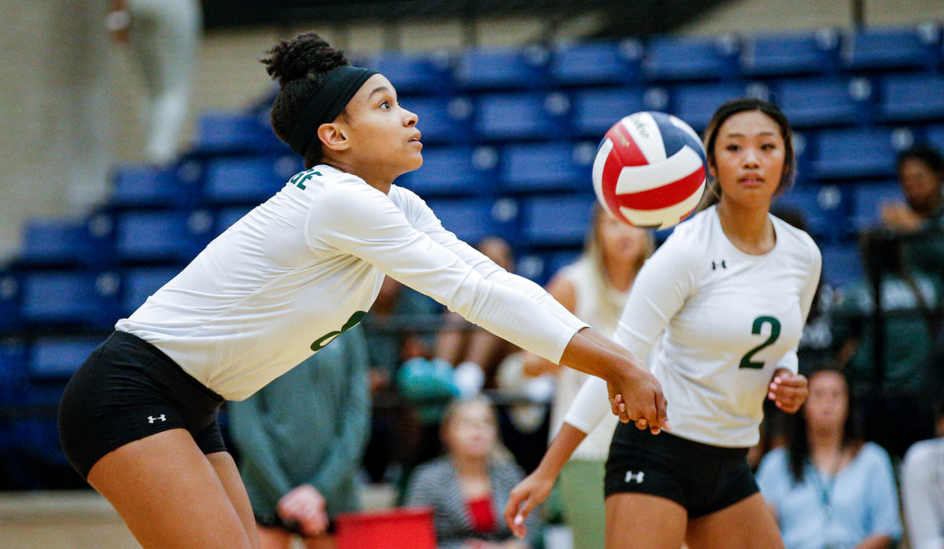 Mansfield Lake Ridge junior Lyric Stewart (8) bumps the ball during a high school volleyball...