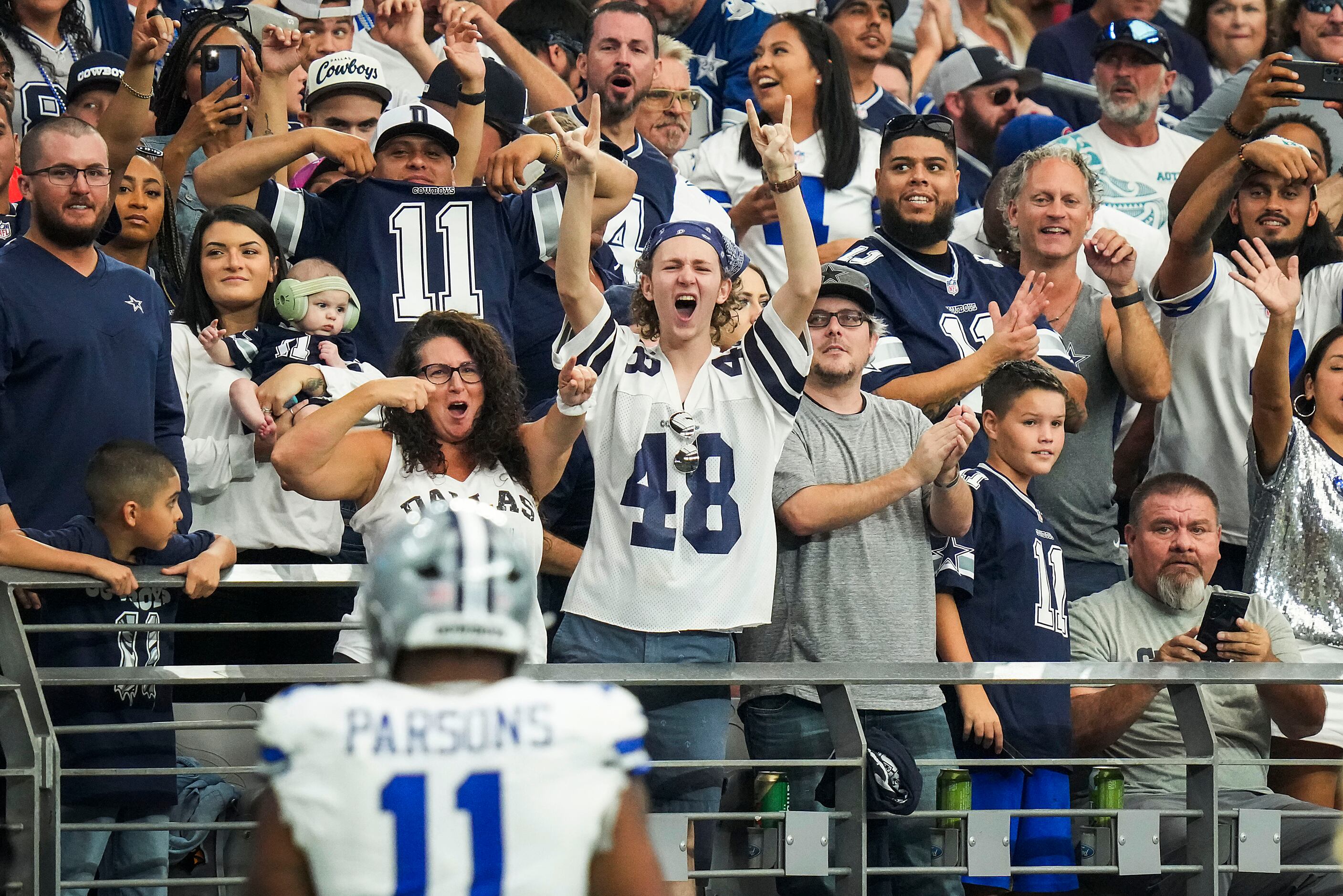 Dallas Cowboys linebacker Micah Parsons (11) watches from the bench during  the second half of an