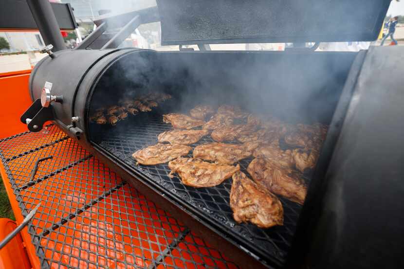 Gradlin Franks of Mansfield cooked chicken on the grill for tailgating at AT&T Stadium...