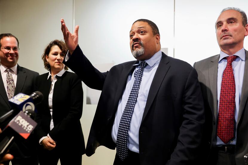 Manhattan District Attorney Alvin Bragg, center, surrounded by his legal team, speaks to the...