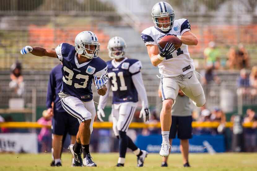 Dallas Cowboys wide receiver Cole Beasley (11) makes a catch over the middle as defensive...