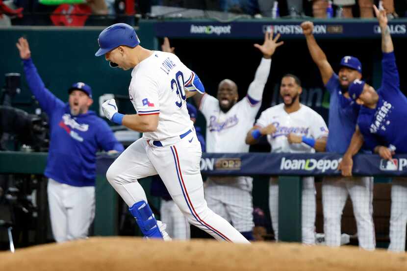 Texas Rangers batter Nathaniel Lowe (30) rounds first on his fifth inning solo home run in...