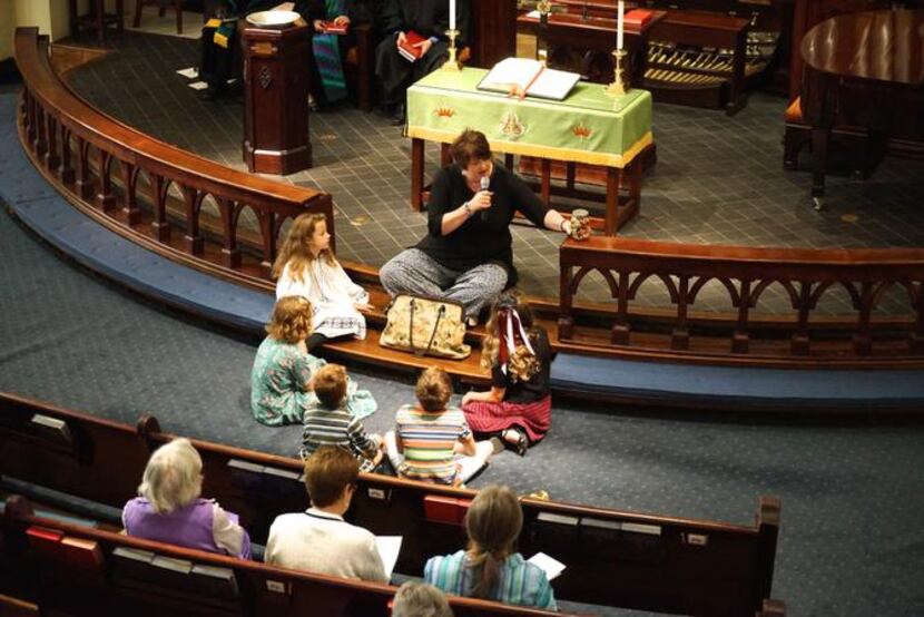 
Elaine Tricoli speaks to children in the congregation during last Sunday’s service. The...