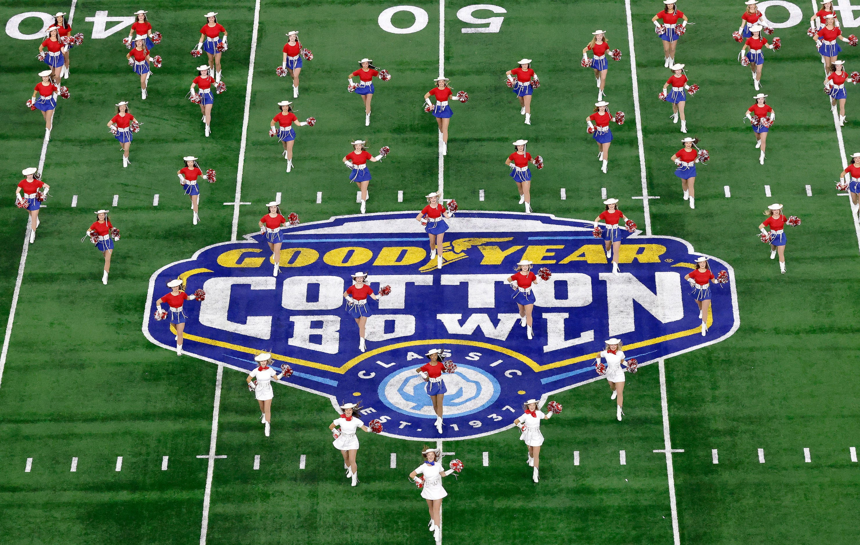 The Kilgore College Rangerettes perform on the field before a CFP semifinal game between the...