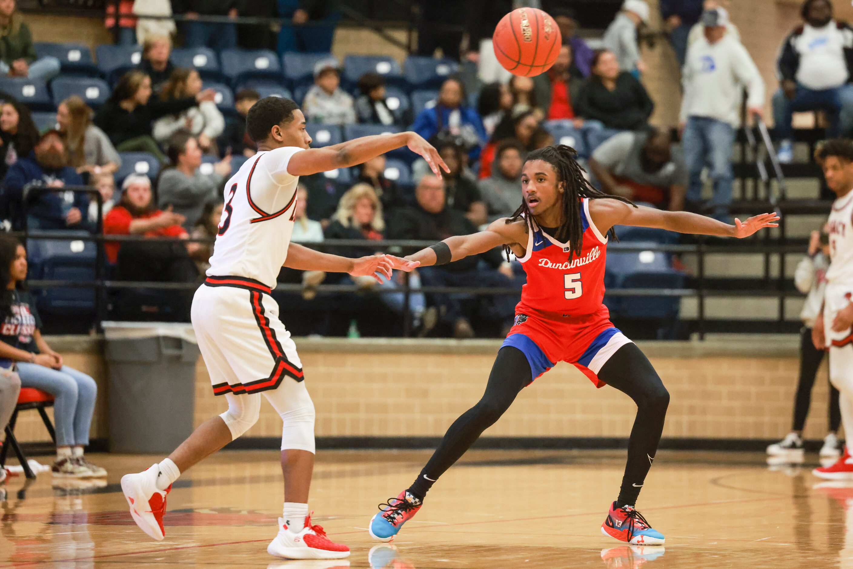 Duncanville High School’s Kayden Edwards (5) defends Mansfield Legacy High School’s Jhaden...