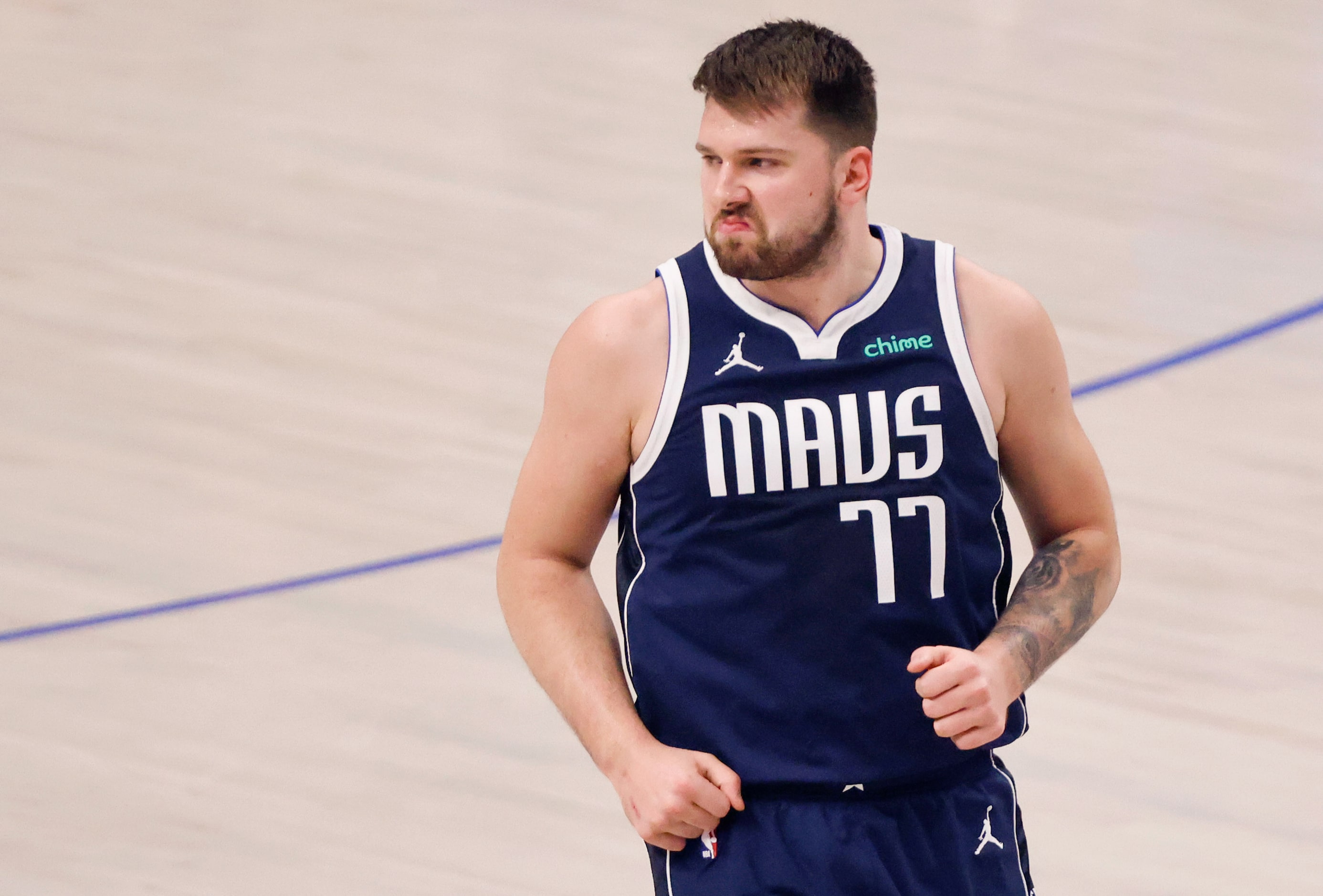 Dallas Mavericks guard Luka Doncic (77) reacts after knocking down a first quarter 3-pointer...